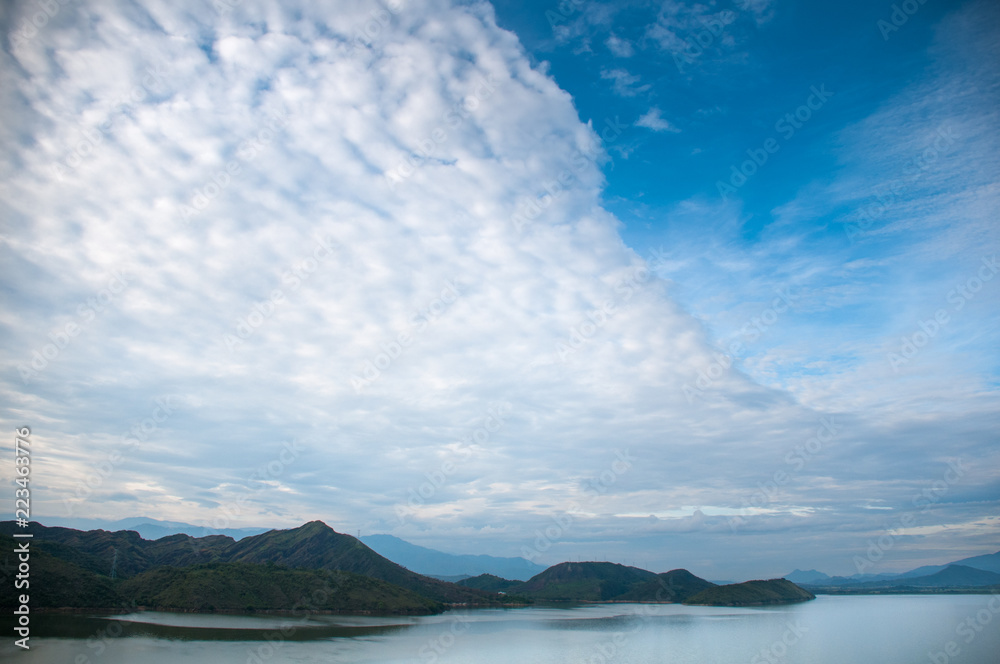 Landscape with accumulated clouds over a dam in the countryside in Colombia. Huila. Colombia