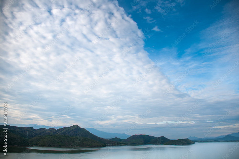 Landscape with accumulated clouds over a dam in the countryside in Colombia. Huila. Colombia Landscape with accumulated clouds over a dam in the countryside in Colombia. Huila. Colombia