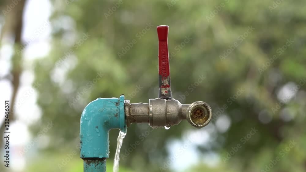 leaking water from blue pipe nature background leaking water from blue pipe nature background