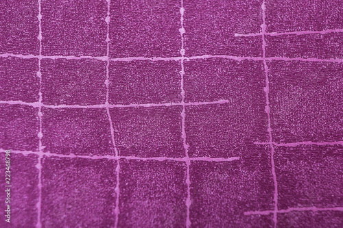 Texture in purple fabric with irregular stripes