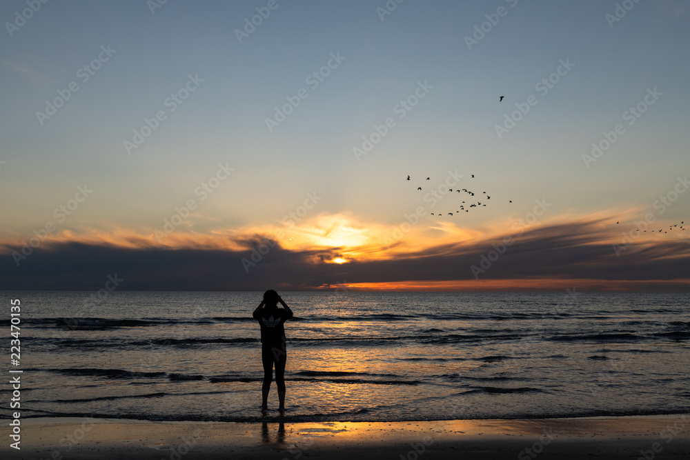 silhouette of girl at sunset