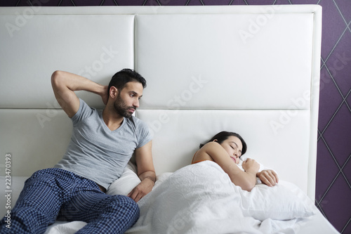 Man Trying Sexual Approach With Woman In Home Bed