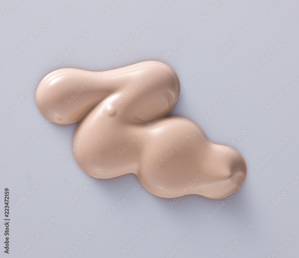the texture of a foundation liquid, a white background the texture of a foundation liquid, a white background