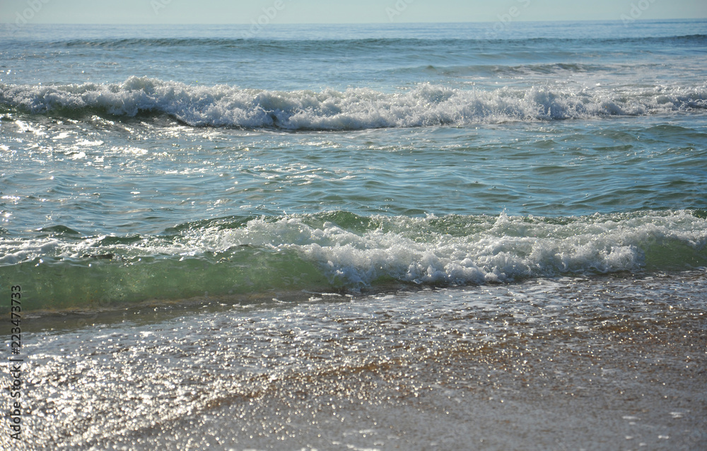 Waves breaking on the beach 