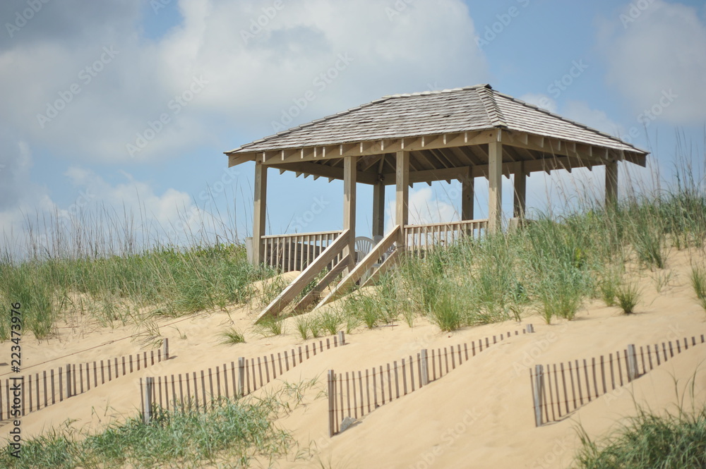 A beach gazebo in the sand dunes