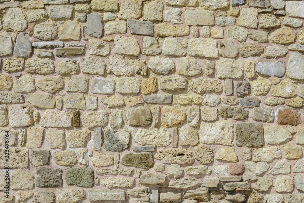 Wall with stones in random size, textured wall for background. Wall with stones in random size, textured wall for background.