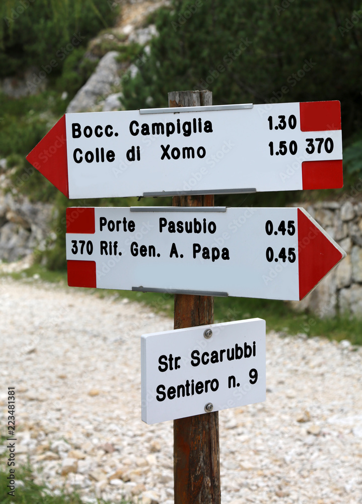 Road sign of the mountain path  in Italian language to go to Pas