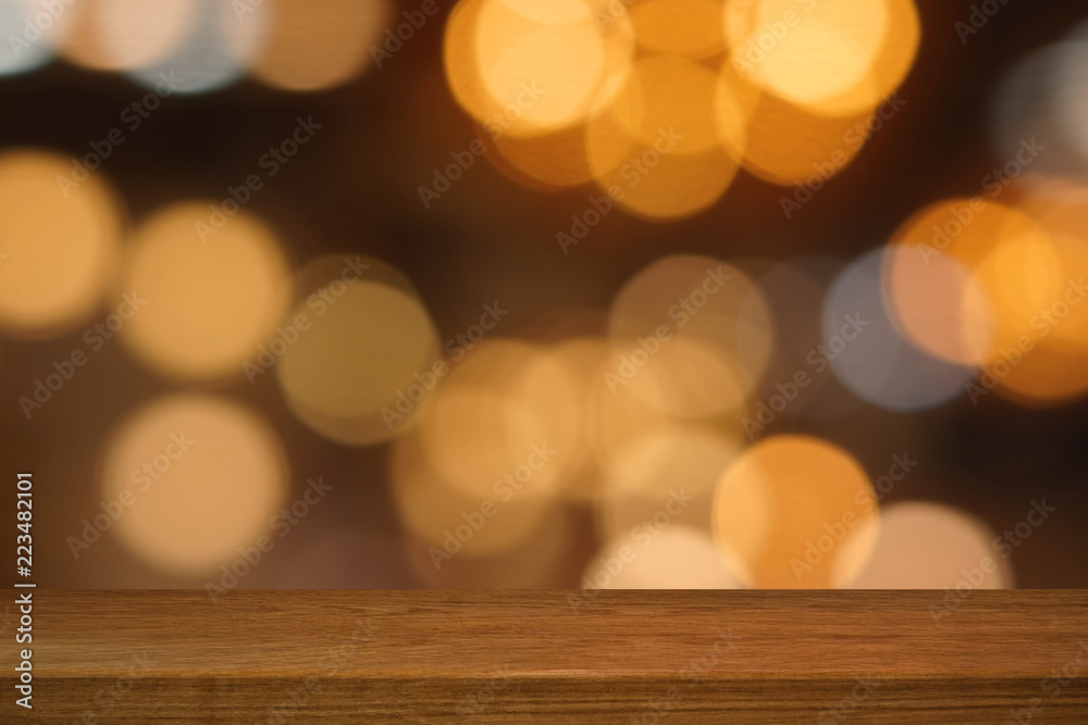 Wooden table in front of blurred background