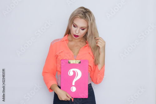 woman holding signboard with question mark photo