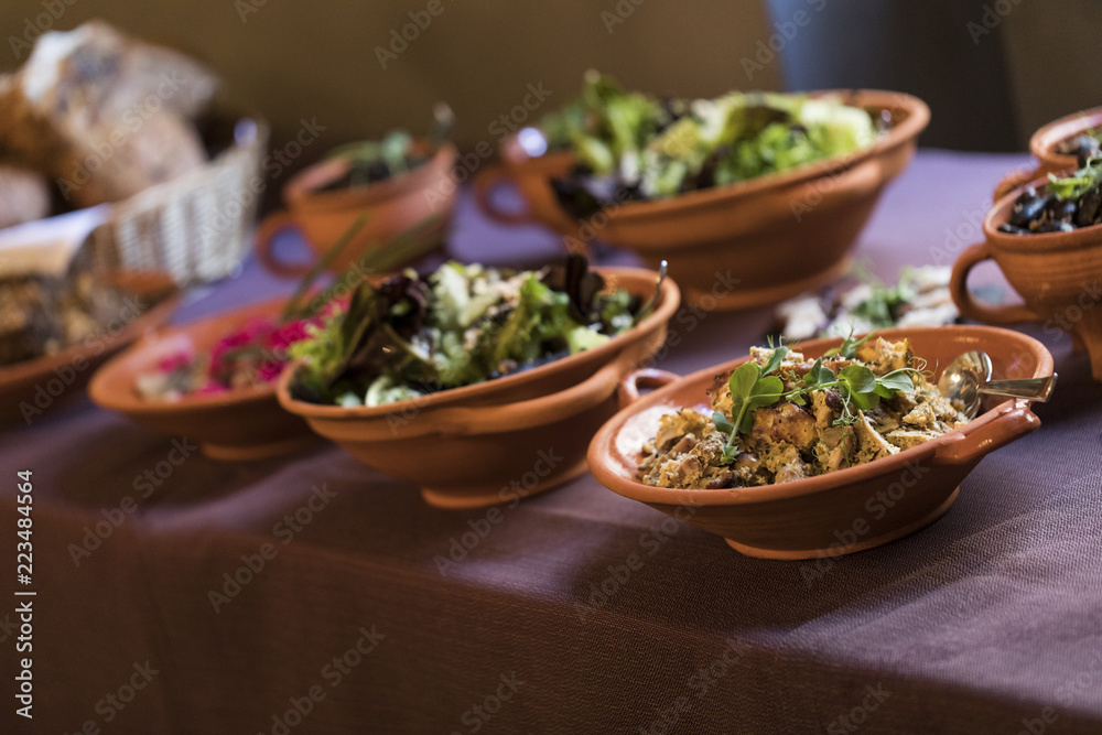 Medieval dishes on a plate on a purple tablecloth Medieval dishes on a plate on a purple tablecloth