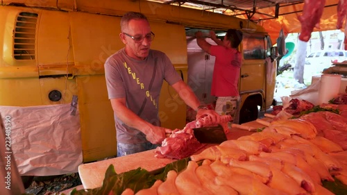 Butcher in street market sunday morning in Rio de janeiro, Brazil