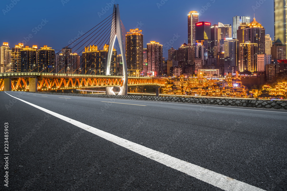 Fototapeta premium Road pavement and Chongqing urban architecture skyline