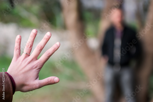 Engagment Photos, rings visible on the hands in the nature. focused rings. blurred background.