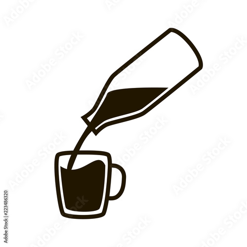 Bottle with milk and cup.
