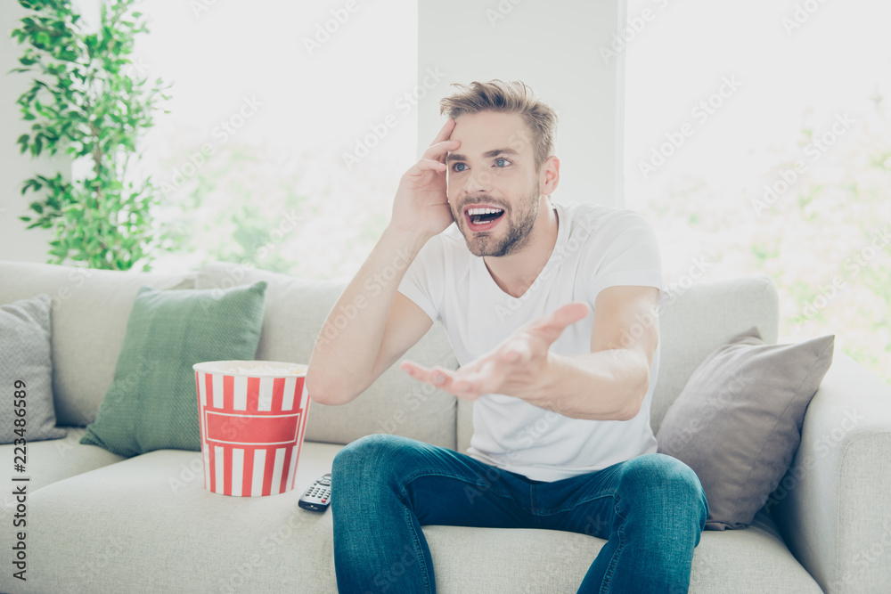 Photo of attractive brunet bristle man in light modern interior Photo of attractive brunet bristle man in light modern interior