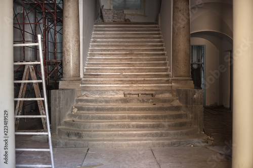 repair in an old building with columns and stairs