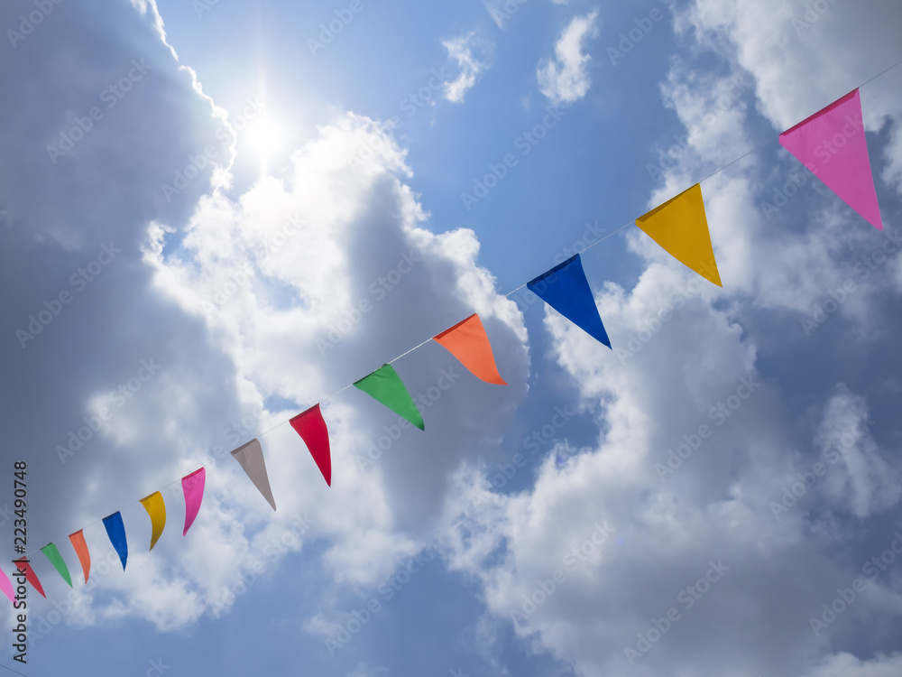 Festival outdoor colourful flag decoration with blue sky background
