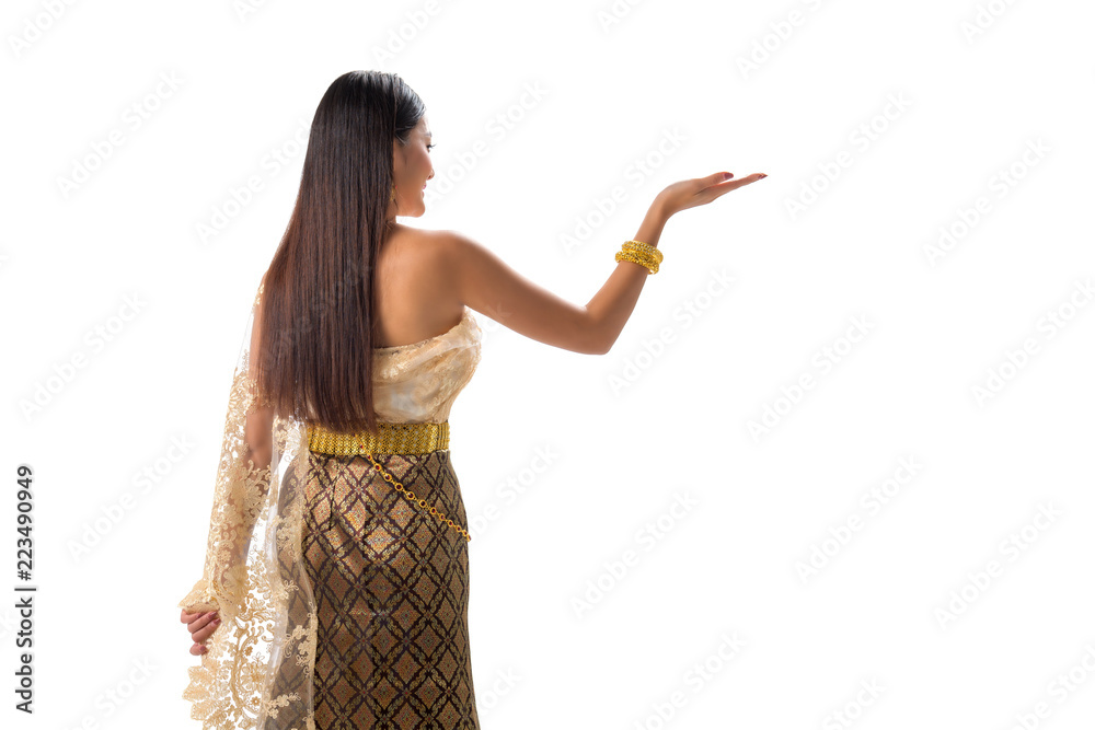 Cute girl in Thai national dress. Looks attractive and so elegant. Thai dress made from greatest Thai silk. Accessories made from gems stone, pearls and Gold. Her eyes looks charm like a spell. Cute girl in Thai national dress. Looks attractive and so elegant. Thai dress made from greatest Thai silk. Accessories made from gems stone, pearls and Gold. Her eyes looks charm like a spell.