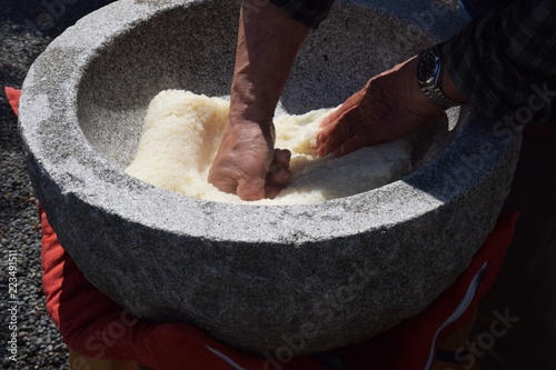 How to make Japanese traditional rice cakes(Mochi-tsuki)is many times pounding with a mallet with the steamed dlutinous rice which was in mortar.