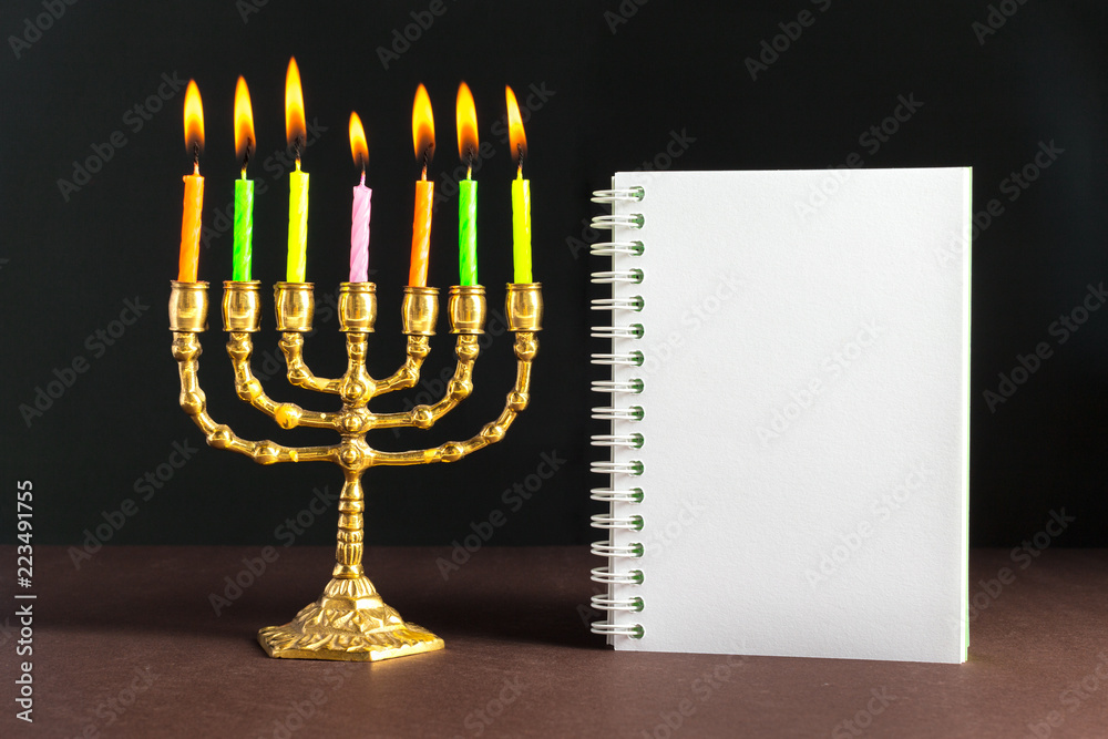 Bronze Hanukkah menorah with burning candles Bronze Hanukkah menorah with burning candles