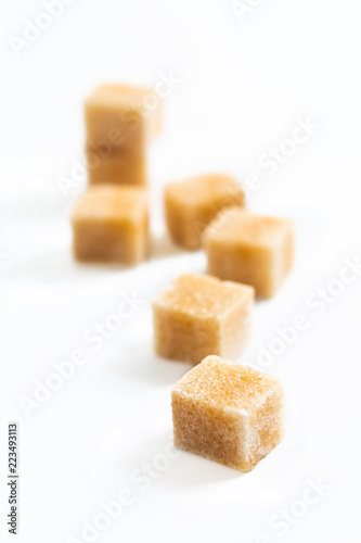 Food Spot focus organic Brown sugar cane cubes on white background