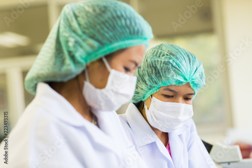 Scientist using a microscope in a laboratory, Concept science and Technology