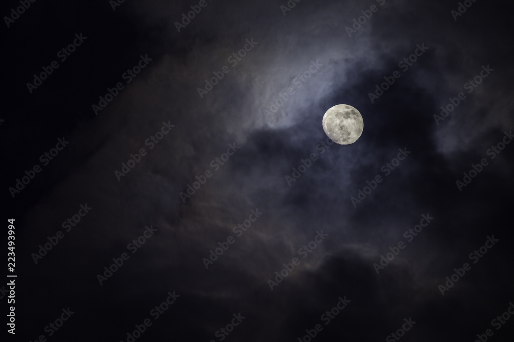 Full moon in the middle of clouds Full moon in the middle of clouds
