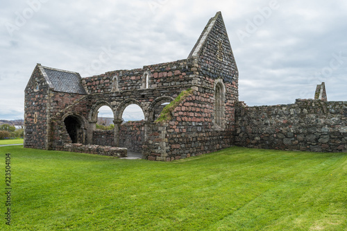 фотографія St Mary's Nunnery, Isle of Iona, Scotland, old building remains, on a cloudy day, surrounded by the green grass