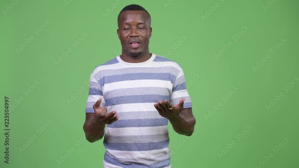 Young African man presenting something Young African man presenting something