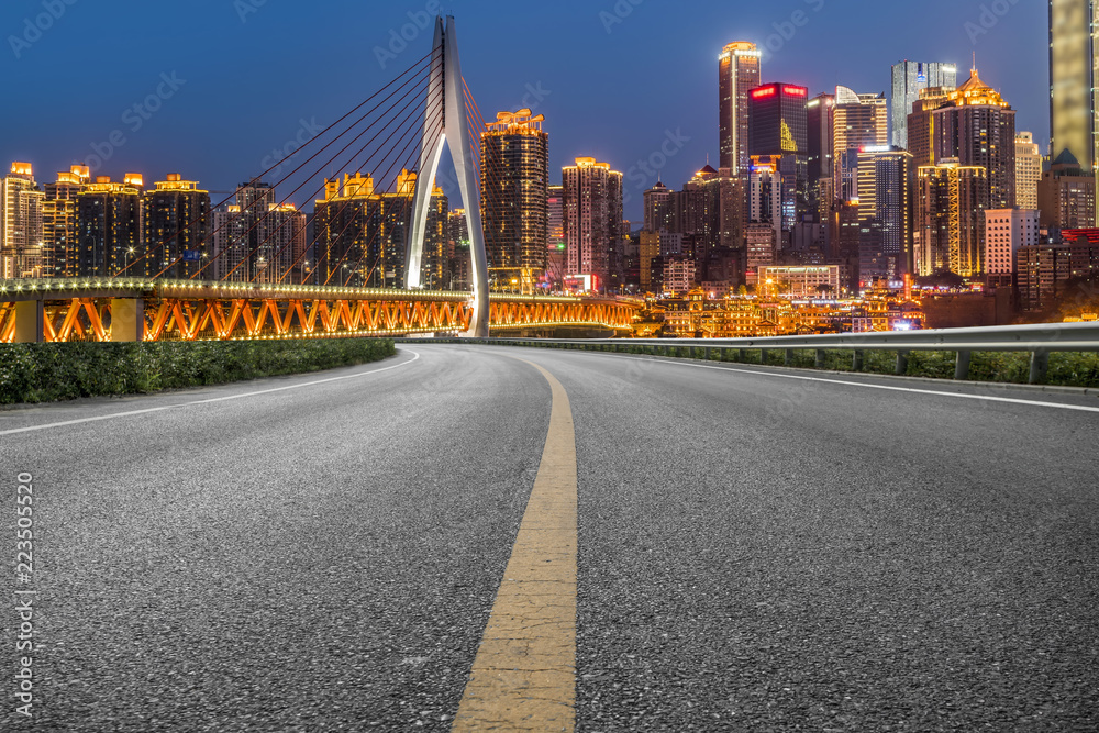 Fototapeta premium Road pavement and Chongqing urban architecture skyline
