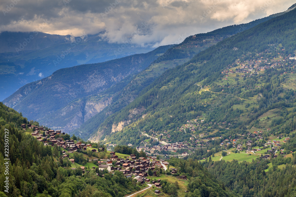 Beautiful view of the Val d’Anniviers valley in Switzerland with the villages saint-luc, saint-jean and vissoie in summer
