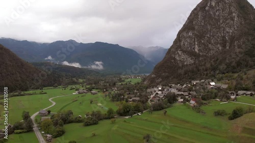 Aerial view of village Srednja Vas near the Bohinj lake in Slovenia. Village surrounded with forest and highest mountains in Slovenia. Part of national park Triglav. photo