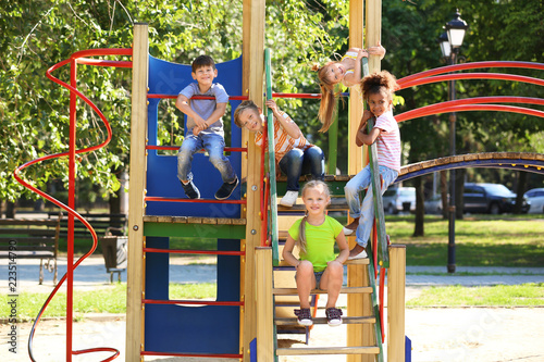 Canvas Print Cute little children having fun on playground outdoors