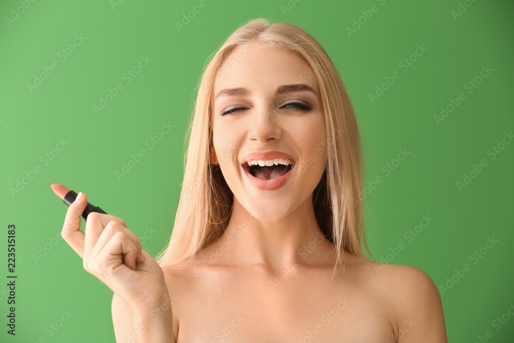 Beautiful young woman with pink lipstick on color background Beautiful young woman with pink lipstick on color background