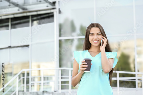 Young businesswoman talking...
