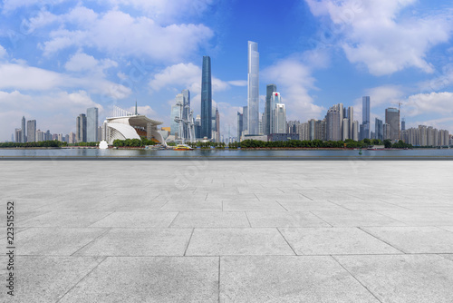 Urban skyscrapers with empty square floor tiles