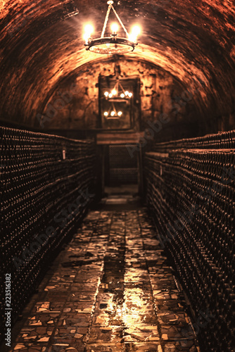 Old wine cellar with a group of wine bottles