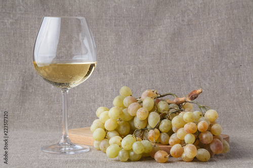 Glass of cold white wine with fruits