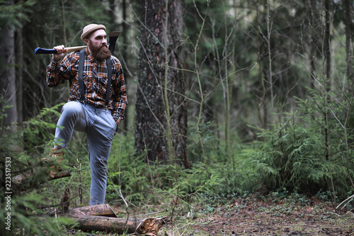 A bearded lumberjack with a large ax 