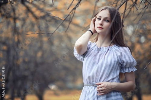 Young girl on a walk in the autumn 