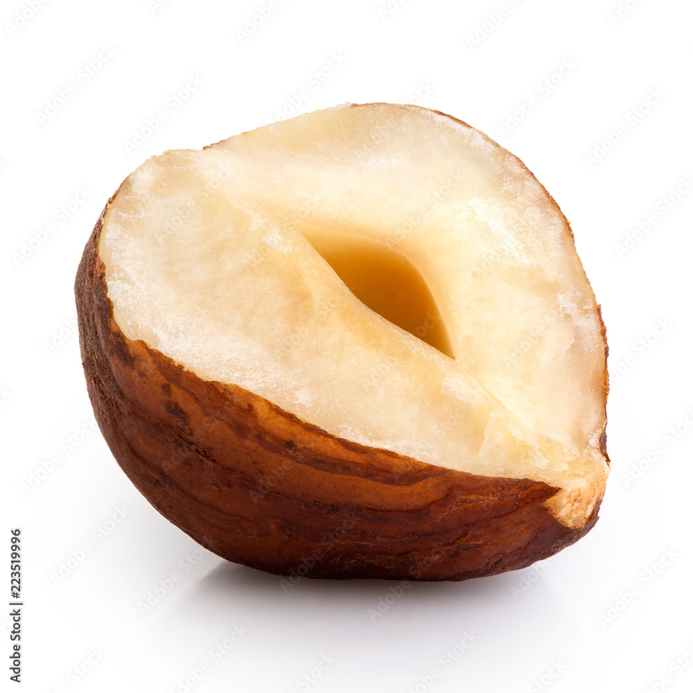 Half of a hazelnut with skin isolated on white. Closeup. Half of a hazelnut with skin isolated on white. Closeup.