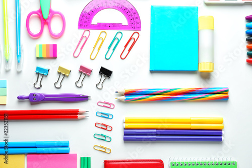 Composition with different school stationery on white background