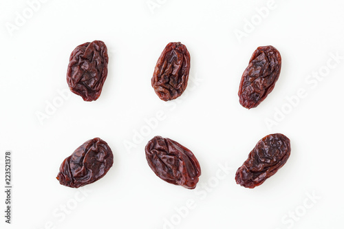 Raisins isolated on white, top view