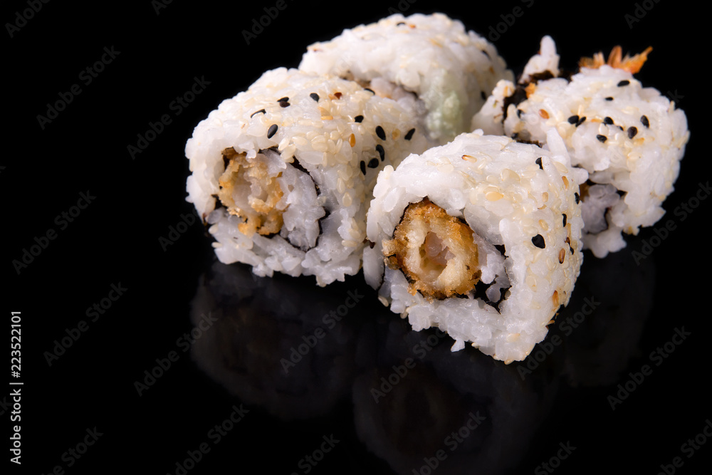 Macro shot of sushi rolls on dark backgorund Macro shot of sushi rolls on dark backgorund