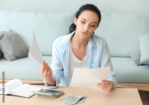 Young woman working with fi...