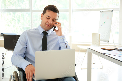 Businessman in wheelchair t...