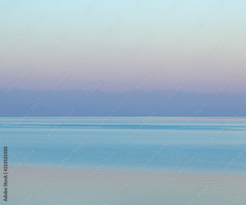 A gentle pink dawn on the sea