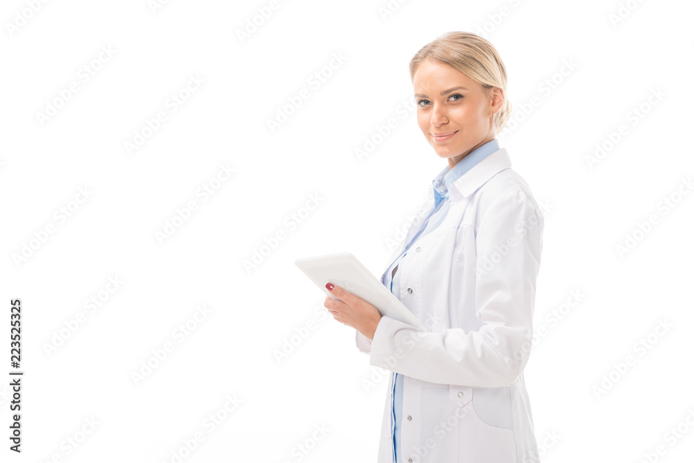 happy young female doctor working with tablet and looking at camera isolated on white happy young female doctor working with tablet and looking at camera isolated on white