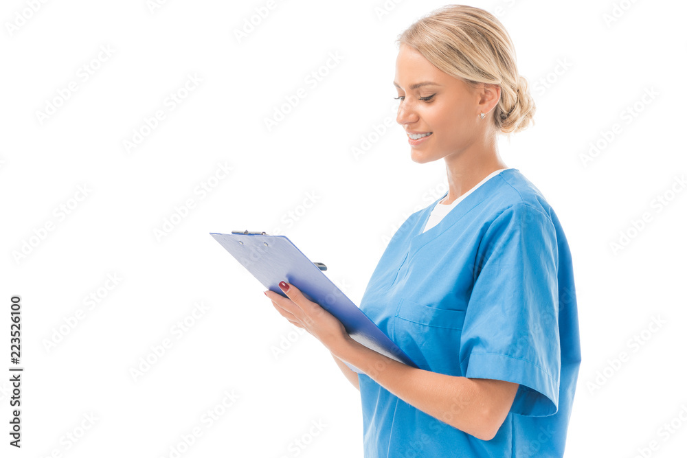 confident young nurse writing in clipboard isolated on white confident young nurse writing in clipboard isolated on white