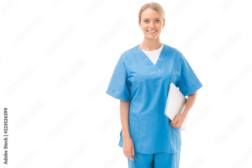 smiling young nurse with laptop looking at camera isolated on white smiling young nurse with laptop looking at camera isolated on white